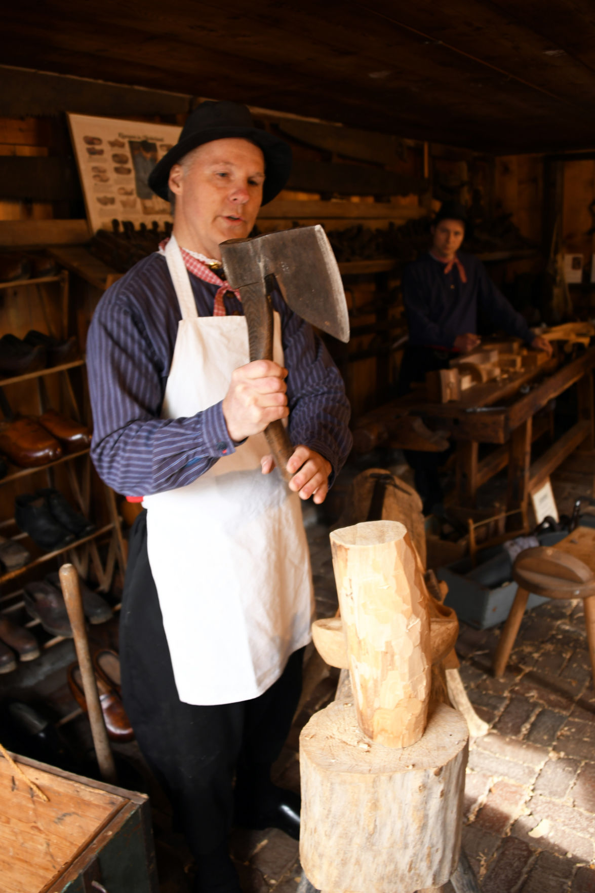 170 The wooden shoemaker demonstrates his equipment.JPG